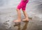 Children playing barefoot sandy beach of Atlantic ocean in Spain