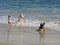 Children playing at the beach, happy days.