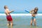 Children playing on the beach waterfighting