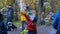 Children playing with big soap bubbles parents taking selfie, slow motion