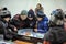 Children playing a board game of hockey