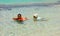 Children playing in the caribbean sea