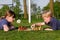 Children playing chess on a football field