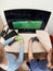 Children playing on games console to play football