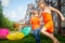 Children playing with garden sprinkler. Brother and sister running and jumping. Summer outdoor water fun in backyard