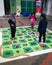 Children are  playing the gigantic rope game or dam tali in Malay language