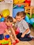 Children playing in kids club indoor. Lesson in primary school.