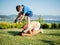 Children playing leap frog outdoors