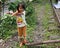 Children playing on the old railway track at Lembah Anai Waterfall near Padang Panjang in West Sumatra, Indonesia.