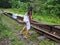 Children playing on the old railway track at Lembah Anai Waterfall near Padang Panjang in West Sumatra, Indonesia.