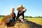 Children Playing Outside on Hay Bale