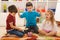 Children playing with a piggybank