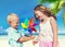 Children Playing with the Pinwheel on a Beach