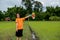 Children playing rainbow pinwheel or windmill on nature, happy kids smiling and funny on pinwheel and windy on rice field