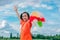 Children playing rainbow pinwheel or windmill on nature, happy kids smiling and funny on pinwheel and windy on rice field