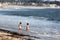 Children playing on Santa Cruz Harbor Beach, California, USA