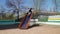 Children playing and sliding on the playground next to a condominium. Swing, slide, stairs, multistory building. A place for child