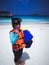 Children playing summer outdoor on beach. Snorkeling attire.