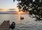 Children playing at sunset in the water