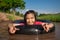 Children playing and swimming in canal of organic farm agriculture in rural