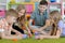 Children playing together floor with green carpet