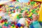 Children playing together in pool with plastic multicolored ball