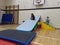 Children playing on top of their base made from soft play equipment