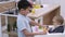 Children playing with toys beside dining table