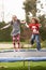 Children Playing On Trampoline