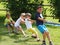 Children playing tug of war during summer games in S. Vigilio Marebbe Italy