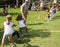 Children playing tug of war during summer games in S. Vigilio Marebbe Italy