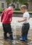 Children playing with water fountain