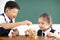 children playing wood blocks in classroom