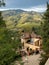 Children playing in a yard among Tuscan landscape