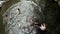 Children plunge and bathe in cold and clean rocky mountain spring water river