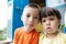 Children portraits sitting in front of home. Little girl and boy. Caucasian russian siblings together. Kids selfie together