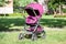 Children pram for baby carriage, compact and collapsable, standing in park, infant perambulator series