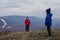 Children of preschool age in jackets and hats are on the mountain foggy cold day