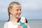 Children psychology. The little beautiful girl embraces an amusing dog - toy. Favorite soft toy.