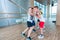 Children and recreation, group of happy multiethnic school kids playing tug-of-war with rope in gym