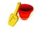 Children red and yellow bucket and spade