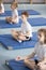 Children in relaxing meditation class