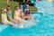 Children rest in the pool in summer