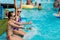 Children rest in the pool in summer