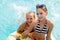 Children rest in the pool in summer