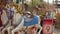 Children ride a horse on a swing in an amusement park in Halloween