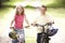 Children riding bikes in countryside