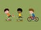 Children riding skateboards and bike. Three little boys.