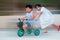Children Riding Tricycle