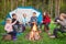 Children roasting marshmallows on camp fire during summer holidays